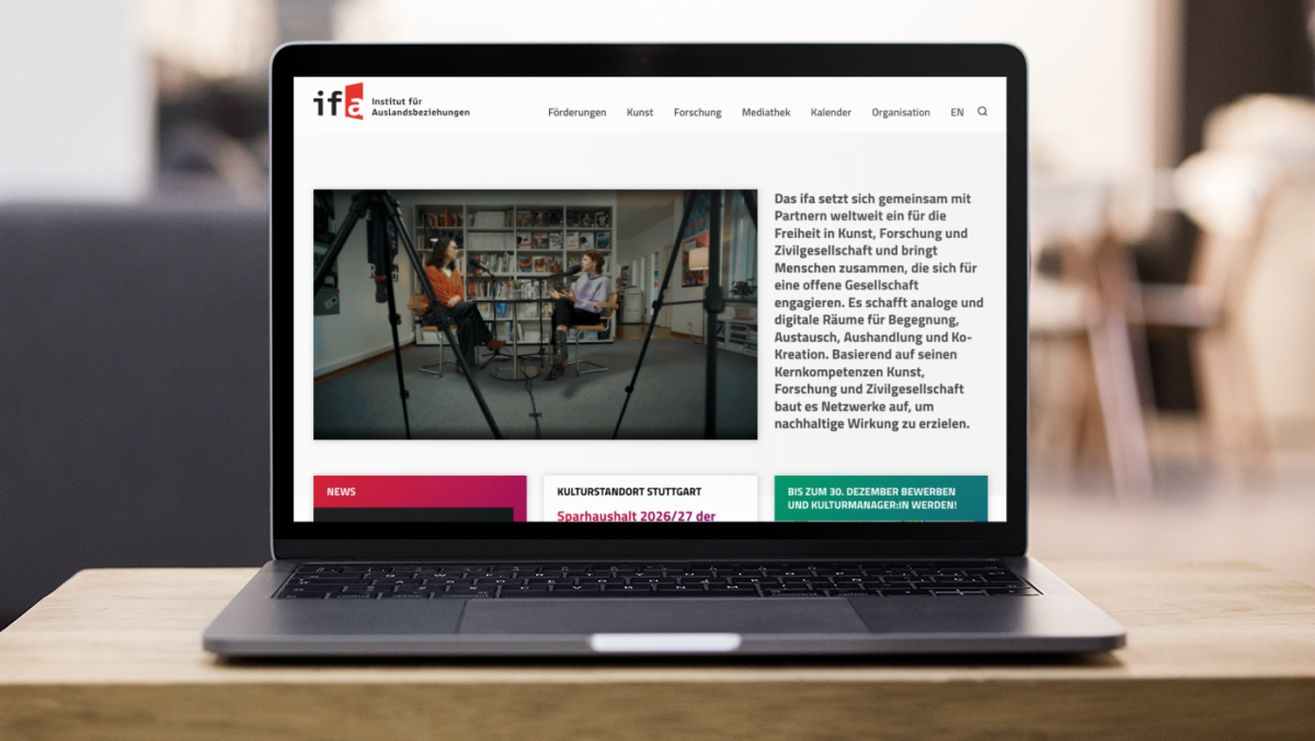 front-shot-of-a-macbook-mockup-standing-on-the-corner-of-a-wooden-desk-a20991_1200x675